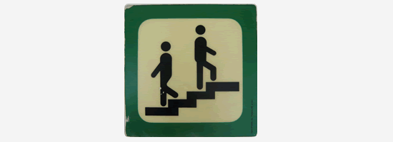 Rejection An exit sign with two people walking up and down some stairs - rejection.