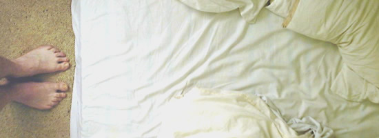 Post: what sex means A person standing facing an unmade bed